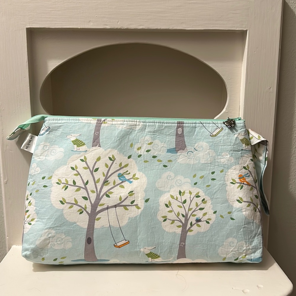Great bag for just about anything. Inside pocket, zipper closure and wrist strap